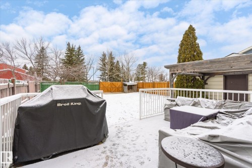Expansive outdoor deck featuring white railings and a wooden pergola structure - 70 Stirling Road, Edmonton, AB - Outdoor With Deck Patio Veranda