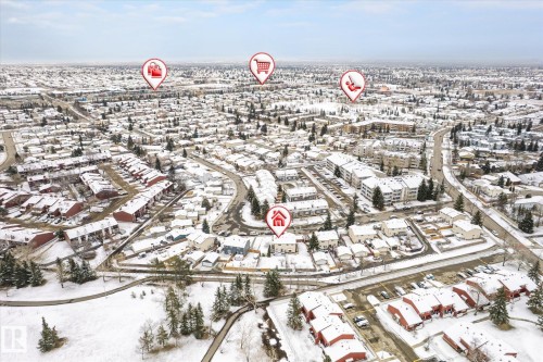 Expansive aerial view showcasing a residential community with varied housing styles and infrastructure - 70 Stirling Road, Edmonton, AB - Outdoor With View