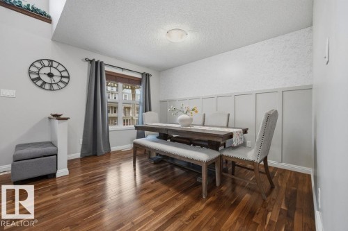 Wood-finish flooring throughout - 1613 Kerr Road, Edmonton, AB - Indoor Photo Showing Dining Room