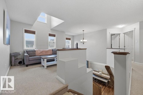 Upper-level landing featuring a skylight and multiple windows - 1613 Kerr Road, Edmonton, AB - Indoor
