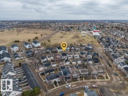 Aerial perspective showcasing an established residential neighborhood with varied architectural styles - 