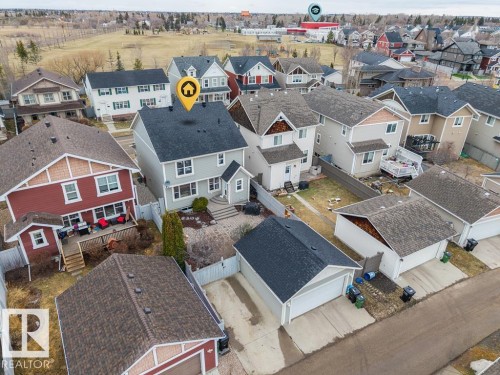 Light grey siding exterior with dark shingle roofing - 1613 Kerr Road, Edmonton, AB - Outdoor