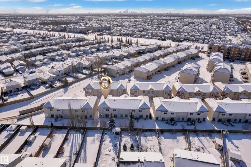 Aerial perspective showcasing a residential community with townhome-style residences - 110 13825 155, Edmonton, AB - Outdoor With View