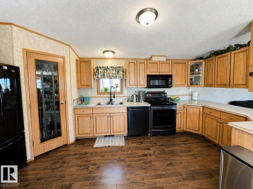 4703 51 Avenue, La Corey, AB - Indoor Photo Showing Kitchen With Double Sink
