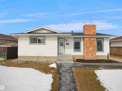 White siding exterior with green trim accents - 11044 166 Avenue, Edmonton, AB - Outdoor