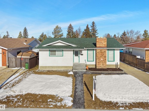 Single-story residence featuring white siding and a green shingle roof - 11044 166 Avenue, Edmonton, AB - Outdoor