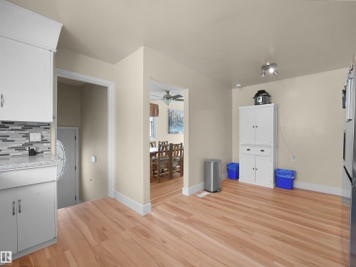 Wood-finish flooring throughout, complemented by light-toned wall paint - 11044 166 Avenue, Edmonton, AB - Indoor