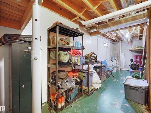 Unfinished basement featuring exposed wood ceiling joists and concrete walls - 11044 166 Avenue, Edmonton, AB - Indoor Photo Showing Basement