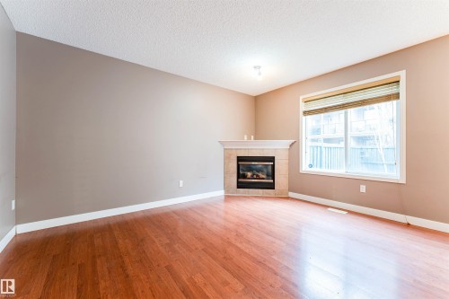 72 2021 Grantham Court, Edmonton, AB - Indoor Photo Showing Living Room With Fireplace