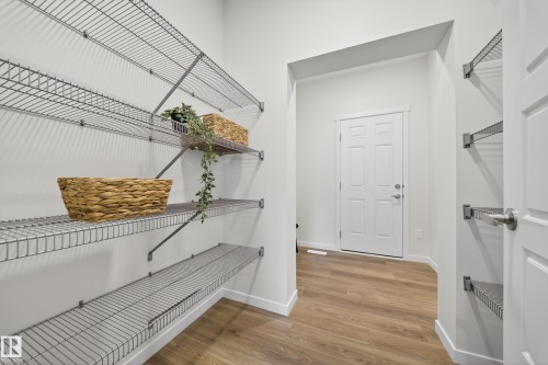 Dedicated storage area featuring expansive wire shelving systems - 20723 24 Avenue, Edmonton, AB - Indoor With Storage