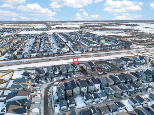 Aerial perspective showcasing a residential neighborhood with diverse housing styles - 20723 24 Avenue, Edmonton, AB - Outdoor With View