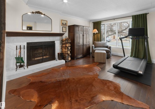 8960 77 Avenue, Edmonton, AB - Indoor Photo Showing Living Room With Fireplace