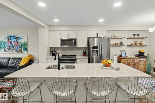 24 165 Cy Becker Blvd, Edmonton, AB - Indoor Photo Showing Kitchen With Stainless Steel Kitchen With Double Sink With Upgraded Kitchen