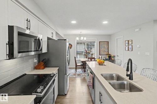 24 165 Cy Becker Blvd, Edmonton, AB - Indoor Photo Showing Kitchen With Double Sink