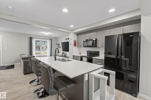 1096 Cy Becker Road, Edmonton, AB - Indoor Photo Showing Kitchen With Double Sink