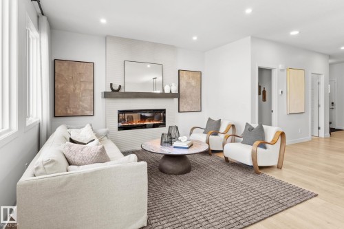 3195 Erlanger Way, Edmonton, AB - Indoor Photo Showing Living Room With Fireplace