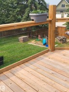 Newly constructed wooden deck featuring light-toned wood planks - 