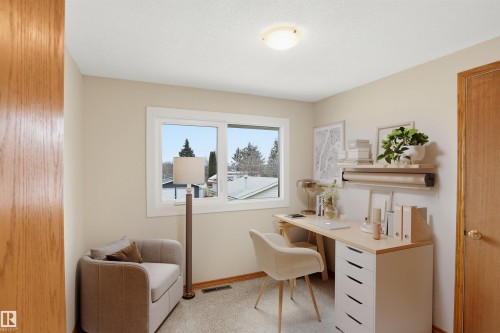 Room featuring neutral wall color, white trim, and a window with a light-colored frame - 23 Clearwater, Devon, AB - Indoor Photo Showing Other Room