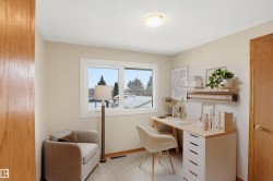 Room featuring neutral wall color, white trim, and a window with a light-colored frame - 