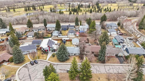 Modern architectural residence featuring a distinctive roofline, solar panel installation, and a contemporary exterior color palette - 23 Clearwater, Devon, AB - Outdoor With View