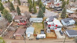 Spacious lot with a detached garage and ample driveway space - 
