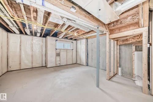 Unfinished basement providing open space and exposed ceiling joists - 38 1910 Collip View, Edmonton, AB - Indoor Photo Showing Basement