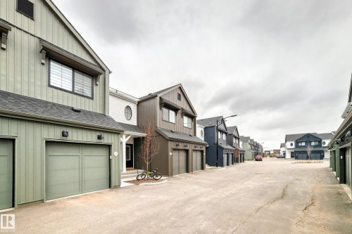 Modern architectural design featuring vertical siding and gabled rooflines - 38 1910 Collip View, Edmonton, AB - Outdoor With Exterior