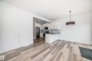 Open-concept living space featuring wood-finish flooring - 38 1910 Collip View, Edmonton, AB  - Indoor Photo Showing Kitchen 