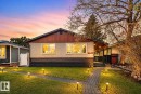 Front exterior with a stucco finish and wood-paneled gable - 13332 106 Street, Edmonton, AB  - Outdoor 