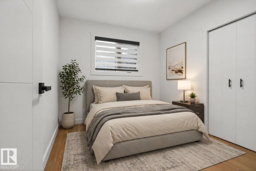 Bright room featuring wood-finish flooring and a window with horizontal blinds - 13332 106 Street, Edmonton, AB - Indoor Photo Showing Bedroom
