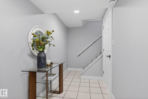 Entrance foyer featuring light tile flooring and a neutral color palette - 13332 106 Street, Edmonton, AB - Indoor Photo Showing Other Room