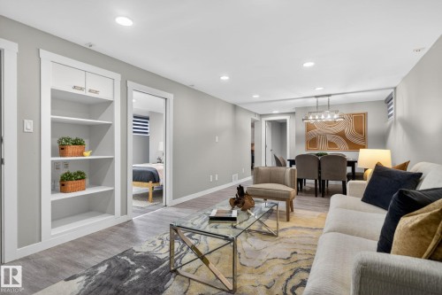 Open-concept living area with recessed lighting and wood-finish flooring - 13332 106 Street, Edmonton, AB - Indoor Photo Showing Living Room