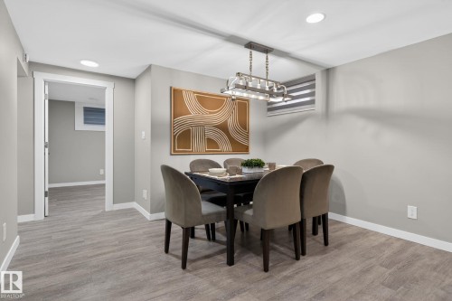 Dining area featuring wood-finish flooring and recessed lighting - 13332 106 Street, Edmonton, AB - Indoor Photo Showing Dining Room
