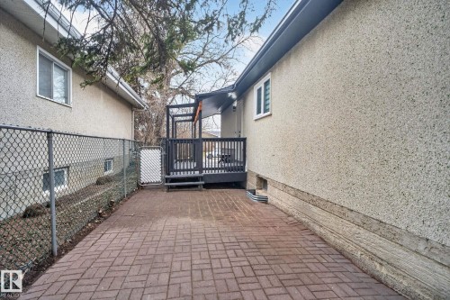 Paver patio leading to a dark-stained deck with a pergola structure - 13332 106 Street, Edmonton, AB - Outdoor With Deck Patio Veranda With Exterior