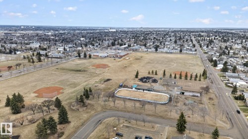 Expansive open fields featuring multiple baseball diamonds, a track, and scattered evergreen and deciduous trees - 13332 106 Street, Edmonton, AB - Outdoor With View