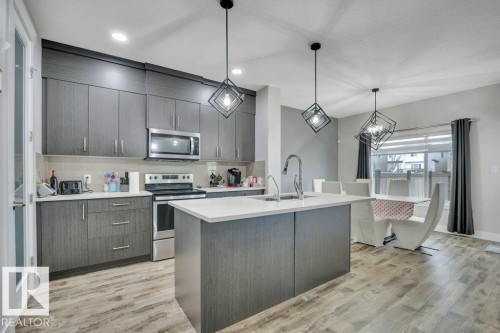 100 Aston Bend, Leduc, AB - Indoor Photo Showing Kitchen With Upgraded Kitchen