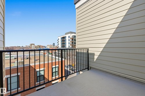Private outdoor balcony with a concrete floor and black metal railing - 403 10418 81 Avenue, Edmonton, AB - Outdoor With Balcony With Exterior