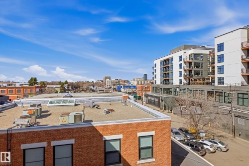 Urban building exterior featuring red brick construction, black-framed windows, and a flat roofline - 403 10418 81 Avenue, Edmonton, AB - Outdoor