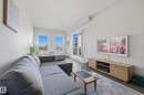 Living space featuring dark wood-finish flooring, light grey walls, and a recessed ceiling - 403 10418 81 Avenue, Edmonton, AB  - Indoor Photo Showing Living Room 