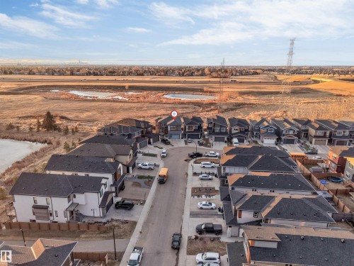 Aerial perspective of a residential neighborhood with varied housing styles - 3736 1 Avenue Sw, Edmonton, AB - Outdoor With View
