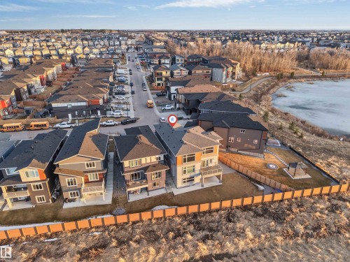 Contemporary residential property featuring a multi-level design and a fenced backyard - 3736 1 Avenue Sw, Edmonton, AB - Outdoor With View