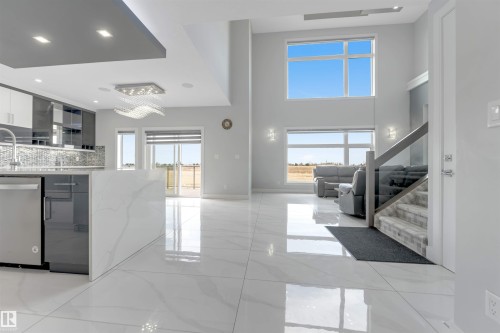 Open-concept living space with large format tile flooring throughout - 3736 1 Avenue Sw, Edmonton, AB - Indoor