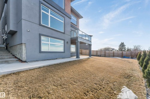 Contemporary exterior with gray stucco finish and contrasting wood-finish siding details - 3736 1 Avenue Sw, Edmonton, AB - Outdoor With Exterior