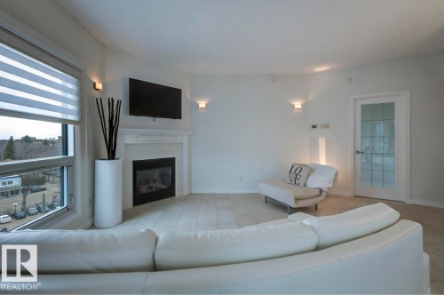 606 10108 125 Street, Edmonton, AB - Indoor Photo Showing Living Room With Fireplace