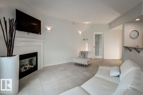 606 10108 125 Street, Edmonton, AB - Indoor Photo Showing Living Room With Fireplace