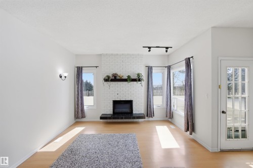 4203 52 Avenue, Beaumont, AB - Indoor Photo Showing Living Room With Fireplace