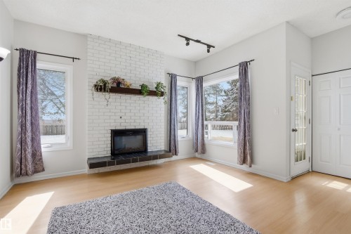 4203 52 Avenue, Beaumont, AB - Indoor Photo Showing Living Room With Fireplace