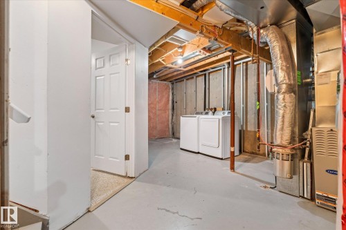 Unfinished basement space featuring exposed joists and concrete walls - 5407 204 Street, Edmonton, AB - Indoor Photo Showing Basement