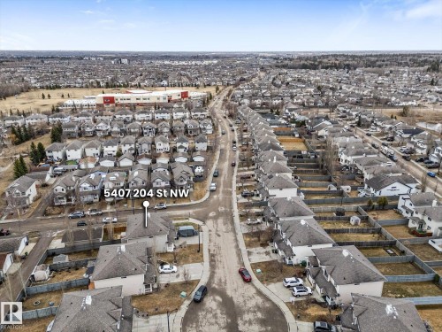 Aerial perspective highlighting a residential neighborhood with varied housing styles - 5407 204 Street, Edmonton, AB - Outdoor With View