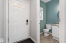 Front entry featuring a white paneled door with transom windows - 5407 204 Street, Edmonton, AB  - Indoor Photo Showing Bathroom 